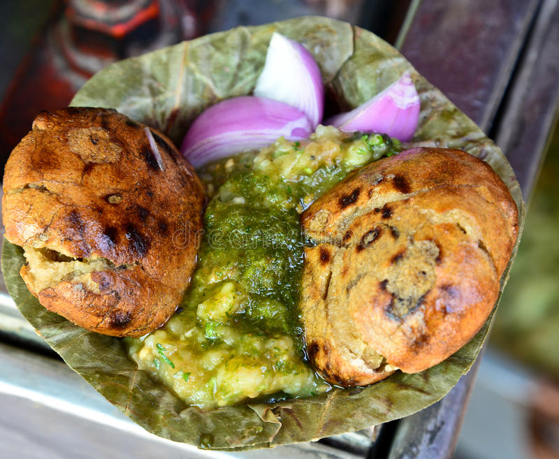 Bati Chokha is dish most liked in the area of eastern Uttar Pradesh. It is an authentic dish comprising of a wheat baati and chokha made of mashed potatoes, brinjal, and tomatoes. It is paired with desi ghee, green chutney, and chaat masala. The baatis are baked in mud ovens which give it a unique aroma and taste.