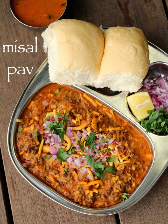 Misal Pav is a common snack on the streets of Mumbai . A mouthwatering mixture of tangy and spicy, a close cousin of Pav Bhaji, this one street delight is tasty as well as filling. It consists of misal (a spicy curry usually made with moth beans) and pav. The final dish is topped with sev, onions, lemon and coriander.