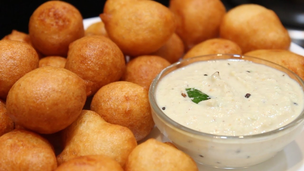 Punugulu or Punukulu is a deep fried snack made with rice, urad dal and other spices. It is often served with peanut chutney called Palli chutney or traditional coconut chutney also called as verusenaga or kandhi pachadi made with toor dal.
